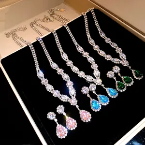 Detailed view of sparkling zirconia water-drop pendant necklace and earring sets in 4 colors