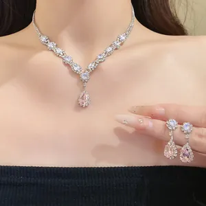 Close-up detail of the elegant pink teardrop zircon necklace and earrings set pieces