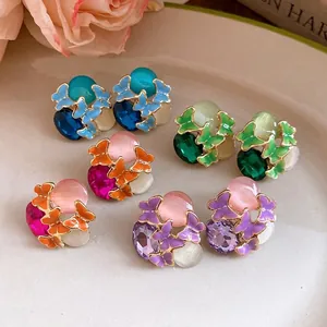 Elegant vintage butterfly stud earrings with colorful cat's eye stones and crystal details