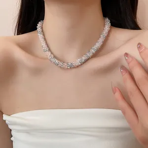 Close-up of pink and grey woven crystal bead choker on model for a refined elegant look.