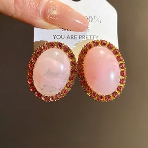 Vintage palace style pink marble acrylic oval stud earrings with rhinestone border decoration