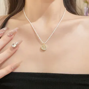 Close-up detail of a double-layer zircon flower pendant necklace on an Asian model
