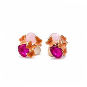 Vintage enamel butterfly stud earrings with pink resin and magenta crystals in gold tone