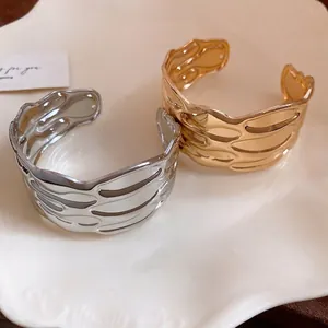 Vintage textured metal open cuff bracelet with elegant striped wavy pattern for women