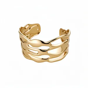 Elegant gold plated open cuff bracelet with wavy cutout texture and minimalist design