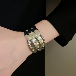 Close-up view of a stylish minimalist textured silver metal open cuff bracelet for women