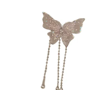 Elegante fermaglio per capelli a farfalla rosa con paillettes e tre lunghe nappe