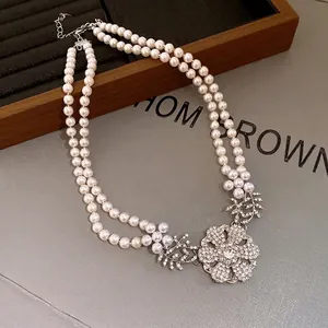 Elegant French style double-layer pearl necklace with sparkling crystal flower pendant