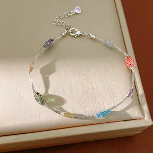 Elegante zilveren armband met kleurrijke zirkoon kralen in fijn vlechtwerk