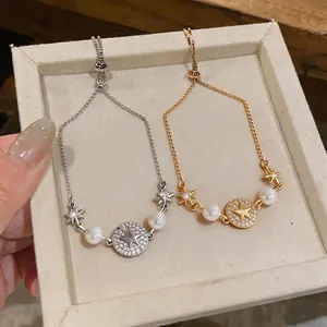 Elegante bracciale placcato oro 14k con pendente a stella, perle e zirconi luminosi