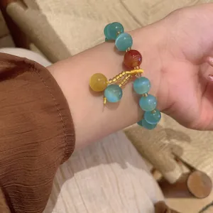 New Chinese style cat's eye beaded bracelet with colorful stone pendants on wrist