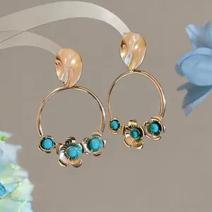 Elegant French vintage gold hoop earrings featuring turquoise flowers and silver needles
