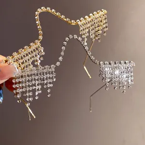 Close-up view of luxury rhinestone tassel eyewear frames in gold and silver finishes