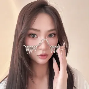 Detailed close-up of a silver rhinestone tassel frame fashion accessory on an Asian model