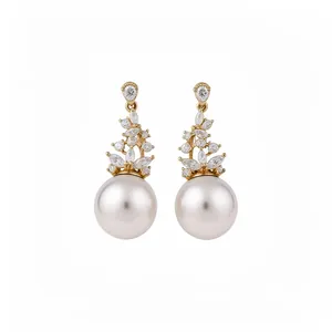 Elegant vintage-style gold earrings with sparkling zircon clusters and large white pearl drops