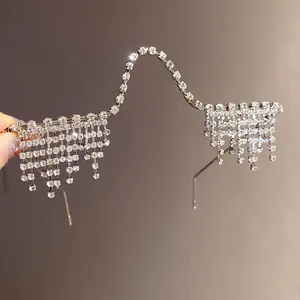 Detail view of sparkly rhinestone tassel lensless glasses frame for party wear