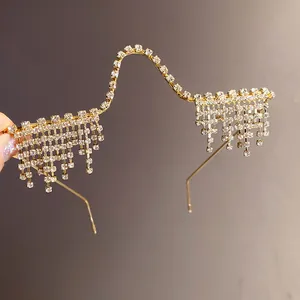 A detailed view of luxury fashion rhinestone tassel glasses frame without lenses in gold