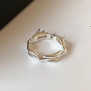 Detailed close-up view of a silver-toned chain link open ring with S925 engraved stamp