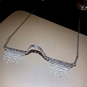 Detailed macro view showing silver rhinestone tassel decor on no-lens eyewear frames