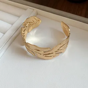 Detailed close-up view of a elegant vintage gold leaf textured open cuff bracelet for women