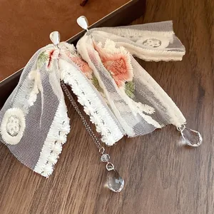 Romantic floral embroidered lace bow earrings with elegant crystal water drop tassels