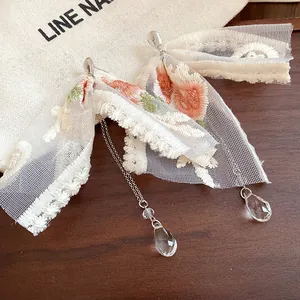 Exquisite flower embroidery lace bow earrings with sparkling crystal teardrop tassels