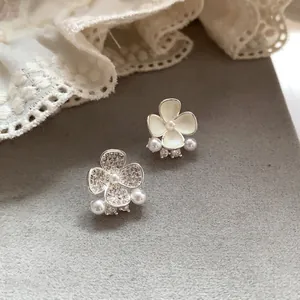 Elegant asymmetrical silver needle flower stud earrings with pearls and crystals