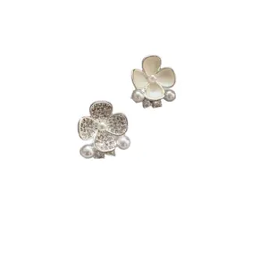 Silver needle asymmetrical flower stud earrings with rhinestones, enamel, and pearls