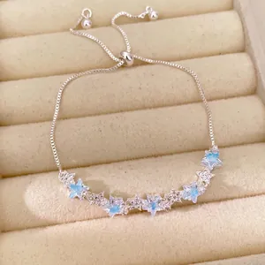 Elegant adjustable silver star bracelet with blue and clear cubic zirconia for women