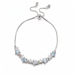 Adjustable silver bracelet with sparkling zircon star charms in light blue and clear