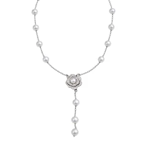 Vintage pearl necklace featuring a sparkling zircon flower pendant in a Y-shaped design