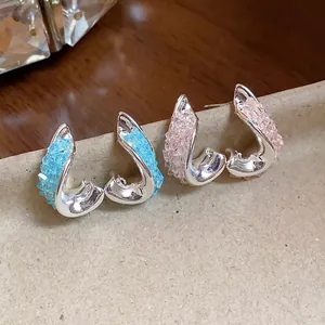 Elegant irregular twisted silver stud earrings with colorful glass crystals and premium finish