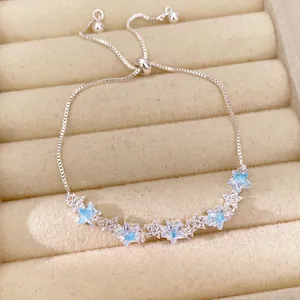 Detailed macro view of the silver star-shaped zircon bracelet with light blue accents.