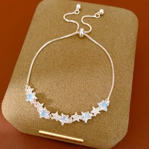 Close-up view of adjustable bolo bracelet featuring sparkling zircon and blue star charms