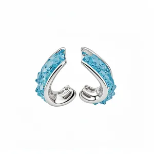 Elegant silver hoop earrings with irregular light blue faceted crystals for a refined look