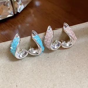 Detailed view of silver needle irregular twisted earrings with colorful crushed glass