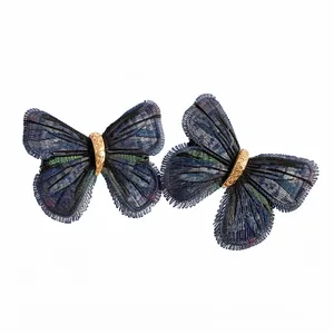 Pair of elegant dark blue butterfly hair clips with detailed golden filigree centers