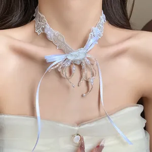 Detailed view of elegant white lace choker necklace featuring pearl flower and bead tassels