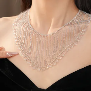 Detail of glass bead fringe necklace showing intricate layers on collarbone