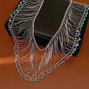 Close-up detail of luxury court style fringe necklace with sparkling light blue glass beads