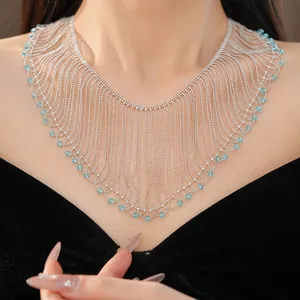 Close-up shot of an elegant light blue glass bead fringe necklace on a model's neck