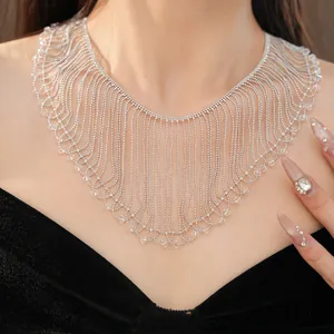 Close-up of elegant silver ball chain fringe necklace with clear glass beads on model