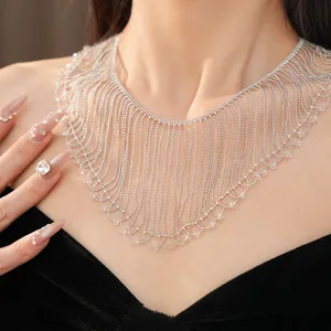 Detailed macro view of an elegant silver fringe bead necklace with crystal accents.