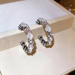 Elegant Korean style silver hoop earrings featuring white cat's eye stones and clear zircon