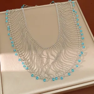 Exquisite detail of multi-layered silver bead necklace with blue glass bead tassels in palace style