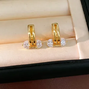 18K gold plated minimalist hoop earrings with oval zircons in a beige velvet jewelry box