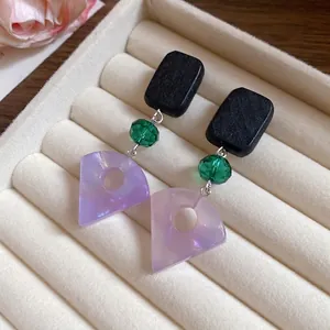 Minimalist geometric wood and lavender resin fan-shaped drop earrings with green beads.
