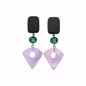 Geometric drop earrings featuring black wood studs, green crystals, and purple resin charms