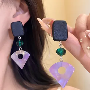 Detailed view of handmade square wood and purple resin fan drop earrings