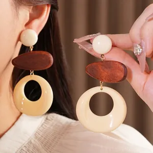 Retro geometric earrings with wooden oval and hollow resin circle in vintage style